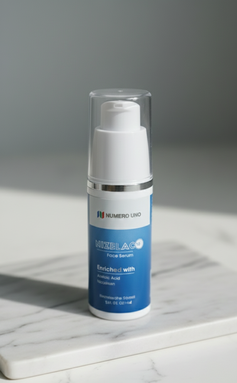 Skincare bottle with blue label on a marble surface